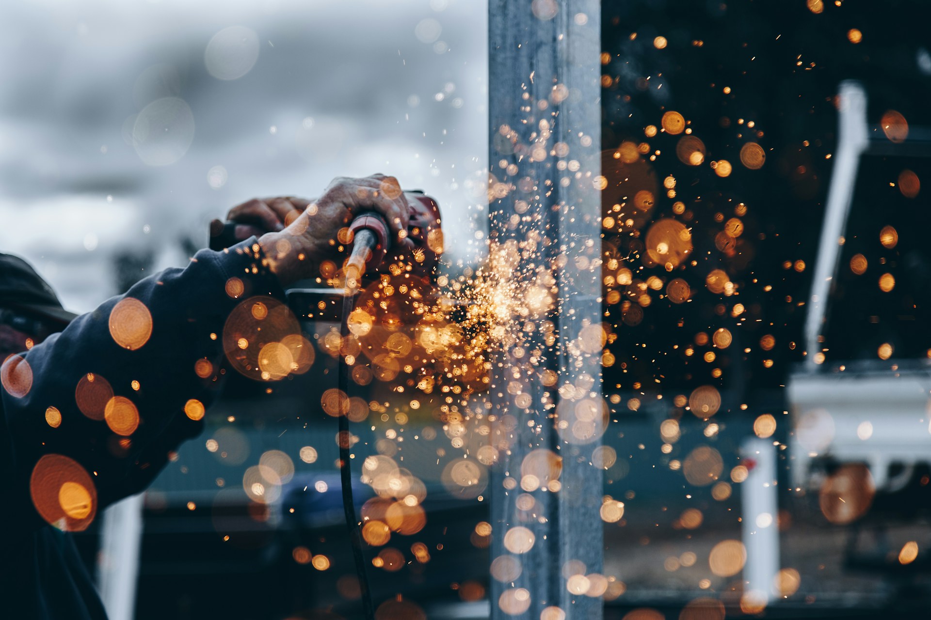 Industrial worker near heavy steel structures
